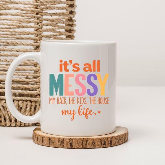 Funny ‘It’s All Messy’ coffee mug for busy moms.